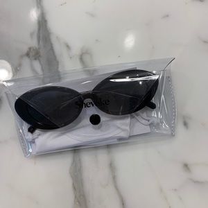 Shevoke “Sylvie” black sunglasses.